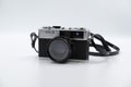 Isolated white background Beautiful vintage analog rangefinder film camera. 70`s Decade film camera. Front view image