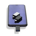 Isolated on a white background phone or smartphone with USB OTG data transfer connected to a USB flash drive Royalty Free Stock Photo
