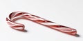 Isolated on white background a single red and white striped candy cane on a white surface Royalty Free Stock Photo