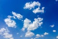 Isolated white clouds on blue sky. Set of isolated clouds over blue background. Design elements. White isolated clouds. Cutout ext Royalty Free Stock Photo