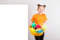 Adorable girl with a basin full of cleaners Royalty Free Stock Photo