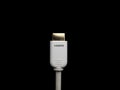 Isolated white HDMI cable on black background. Royalty Free Stock Photo