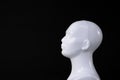 Isolated white mannequin or doll human head on black background Royalty Free Stock Photo