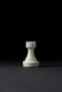 Isolated white rook chess piece on black background Royalty Free Stock Photo
