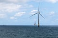 Isolated wind turbine in the Telde sea, town of Gran Canaria island with boats in the background