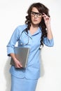 Woman doctor carrying a laptop Royalty Free Stock Photo