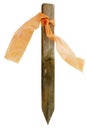Wooden construction survey stake with faded ribbon