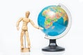 Isolated wooden figure with globe on white background,welcome to Royalty Free Stock Photo