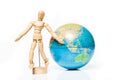 Isolated wooden figure with globe on white background,welcome to Royalty Free Stock Photo