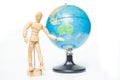 Isolated wooden figure with globe on white background,welcome to Royalty Free Stock Photo