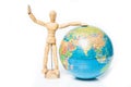 Isolated wooden figure with globe on white background,welcome to Royalty Free Stock Photo