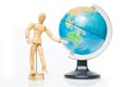 Isolated wooden figure with globe on white background,welcome to Royalty Free Stock Photo