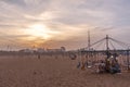 Isolated wooden horse ride swinger for kids during sunset, dark clouds in the background,Marina beach,Chennai,India 19 aug 2017