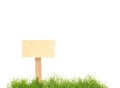 Isolated wooden sign with green grass Royalty Free Stock Photo