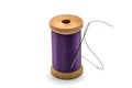 Isolated wooden spool of light purple thread