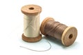 Isolated wooden spool of thread and needle Royalty Free Stock Photo