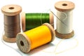 Isolated wooden spools of thread Royalty Free Stock Photo