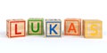 Isolated wooden toy cubes with letters with name lukas