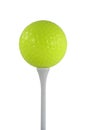 Isolated yellow golf ball on a white tee Royalty Free Stock Photo