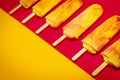 Isolated yellow-red ice cream on a colorful background