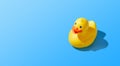 Isolated yellow rubber duck on a blue background. Copy space Royalty Free Stock Photo