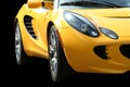 Isolated yellow sports car on black Royalty Free Stock Photo