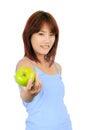 Young asian woman with a green apple. Royalty Free Stock Photo