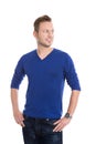 Isolated young blond man in blue pullover looking sideways to te Royalty Free Stock Photo