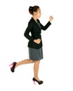 Young business woman running on white. Royalty Free Stock Photo