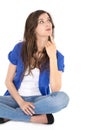 Isolated young reflective female student sitting in crossed legs. Royalty Free Stock Photo