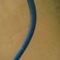 Isolation Corrugation Pipe for electrical wiring against the wall background.