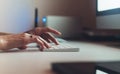 Isolation person working at home monitor computer, freelancer typing on keyboard, closeup finger female hands texting message