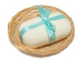 isolation photo of soap with a bow in a basket on a white background