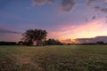 Isoloated house in the field at sunset with cloudy