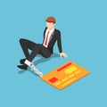 Isometric businessman chained with credit card