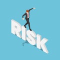 Isometric Businessman Try to Walk and Balancing on Risk Word Royalty Free Stock Photo