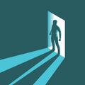 Isometric concept silhouette of man entering dark room with bright light in doorway Royalty Free Stock Photo