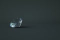 Isometric 3D model of a glass transparent diamond. Precious transparent stone lies on a dark, gray isolated background