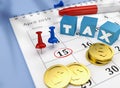 Tax Calendar of 15th April 2019 with colorful pins and coins and cubes with word TAX Royalty Free Stock Photo