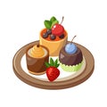 Assorted mini desserts including pudding, tart and chocolate cupcake, served on a plate. Royalty Free Stock Photo