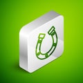 Isometric line Horseshoe icon isolated on green background. Silver square button. Vector