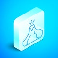 Isometric line Volcano eruption with lava icon isolated on blue background. Silver square button. Vector