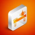 Isometric Massage table with oil icon isolated on orange background. Silver square button. Vector Royalty Free Stock Photo