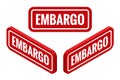 Isometric red rubber print of Embargo text with dirty texture. Embargo stamp Royalty Free Stock Photo