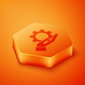 Isometric Settings in the hand icon isolated on orange background. Orange hexagon button. Vector Illustration