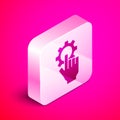Isometric Settings in the hand icon isolated on pink background. Silver square button. Vector