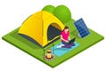 Isometric turistic camp or campground with tent and campfire. The girl works on a laptop, which is connected to a solar