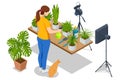 Isometric video blogger planting flower, gardening and housework. Woman or blogger planting pot flowers with camera