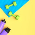 Isometric view of sport equipment like dumbbell, water bottle and yoga mat