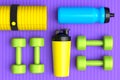 Isometric view of sport equipment like dumbbell, water bottle and yoga mat